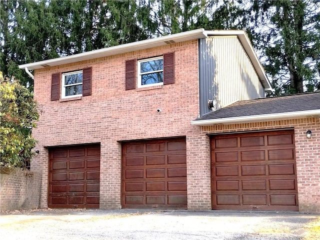 409 Himler Rd, Hempfield Twp Wml, PA 15601 - view of front of house featuring a garage and brick siding