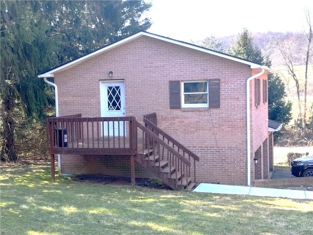409 Himler Rd, Hempfield Twp Wml, PA 15601 - back of house with a yard, brick siding, and a deck