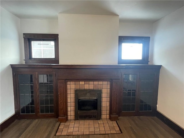 unfurnished living room featuring hardwood / wood-style floors and a fireplace