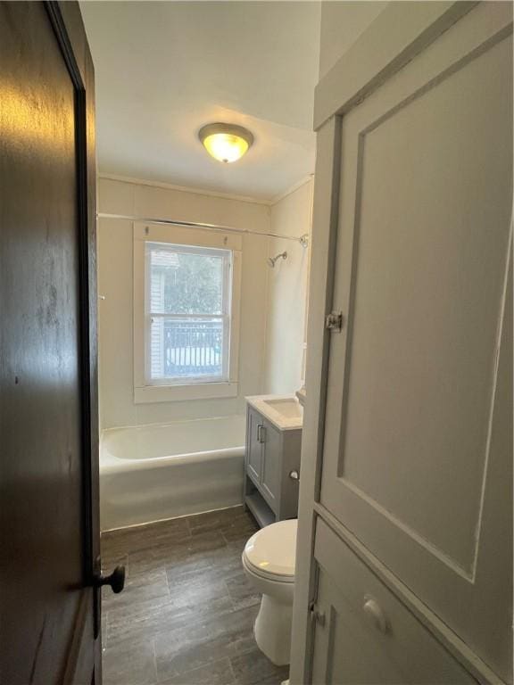 full bathroom featuring shower / bathing tub combination, toilet, and vanity