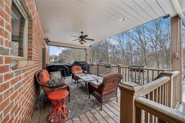 wooden deck with ceiling fan, outdoor lounge area, and grilling area