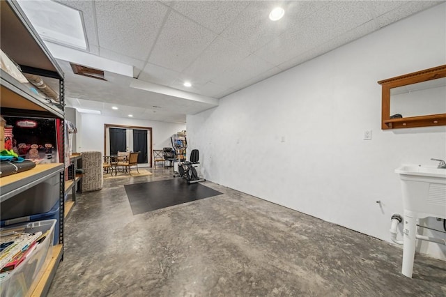 workout room featuring a paneled ceiling