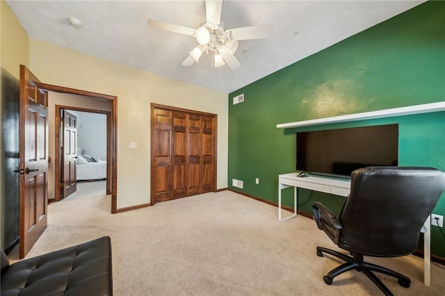 carpeted home office with ceiling fan