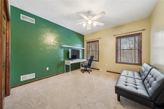 carpeted office with ceiling fan