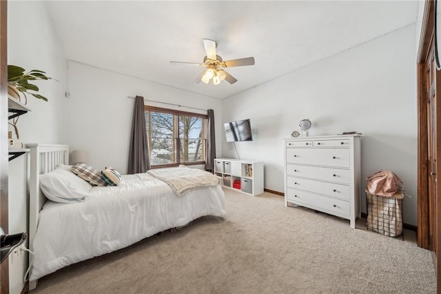 carpeted bedroom with a closet and ceiling fan