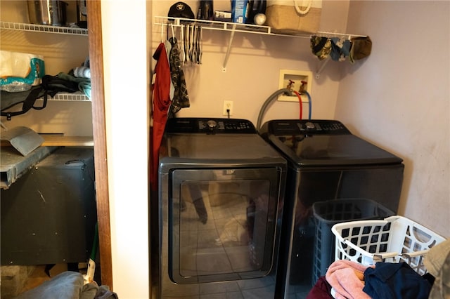 laundry area with washing machine and clothes dryer