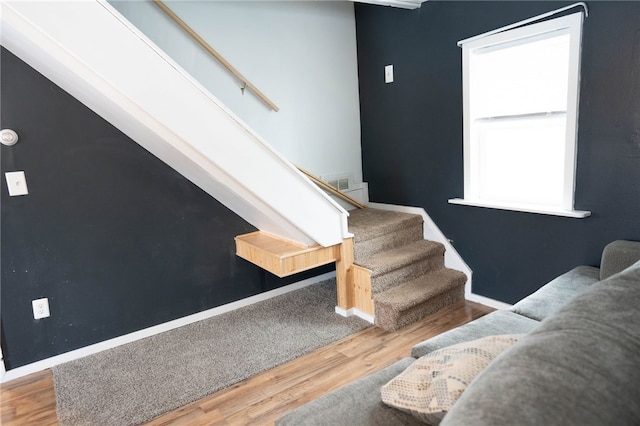 stairway featuring hardwood / wood-style floors