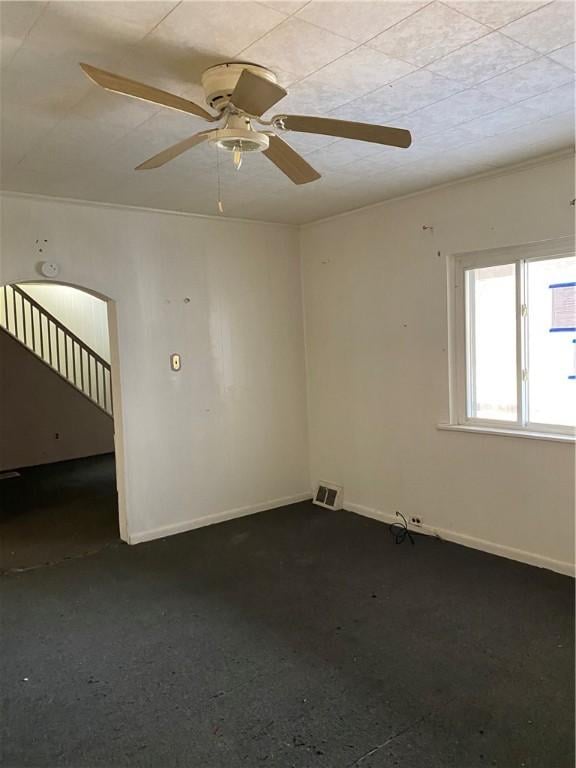 unfurnished room featuring ceiling fan