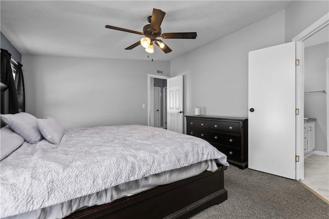 carpeted bedroom with ceiling fan and connected bathroom