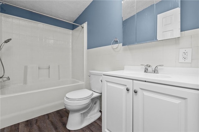 full bathroom featuring shower / bathing tub combination, tile walls, a textured ceiling, hardwood / wood-style floors, and backsplash