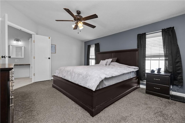 bedroom with vaulted ceiling, carpet flooring, and ceiling fan