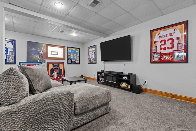 carpeted living room with a paneled ceiling