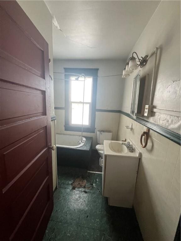 full bathroom with vanity, toilet, and bathtub / shower combination