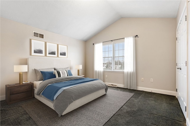 carpeted bedroom featuring vaulted ceiling