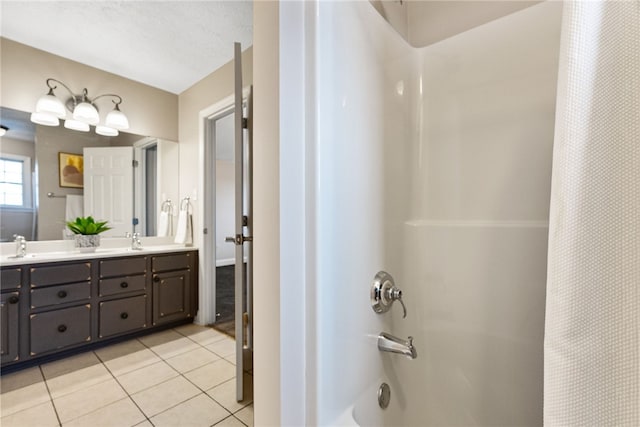 bathroom featuring vanity, shower / tub combo with curtain, and tile patterned flooring