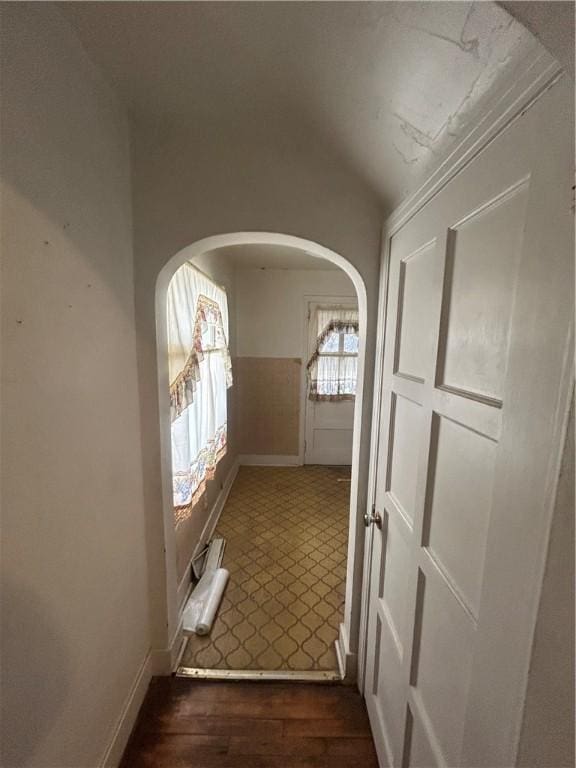 corridor featuring dark hardwood / wood-style flooring