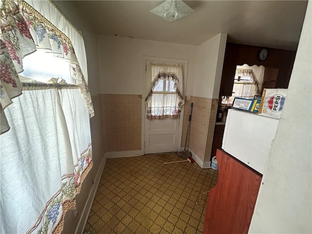 entryway with tile walls