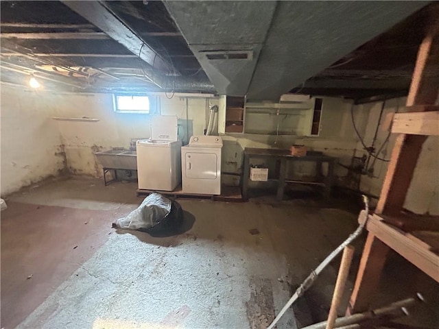 basement with washer and clothes dryer