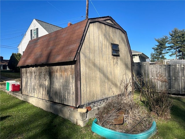 view of side of property with a yard and an outdoor structure