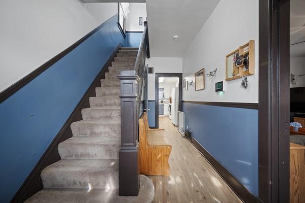 stairs with hardwood / wood-style floors