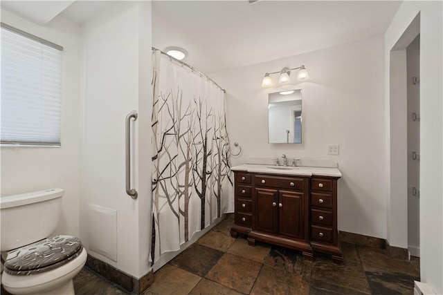 bathroom featuring vanity, a baseboard heating unit, curtained shower, and toilet