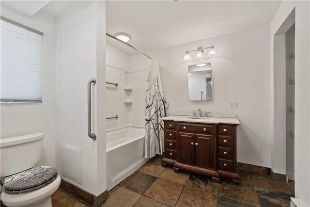 full bathroom with shower / bathtub combination with curtain, vanity, and toilet