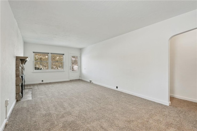 unfurnished living room with carpet