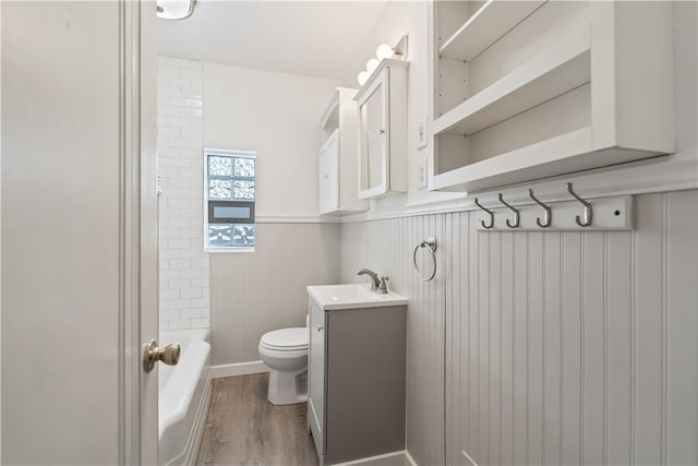 full bathroom with vanity, toilet, shower / washtub combination, and hardwood / wood-style floors