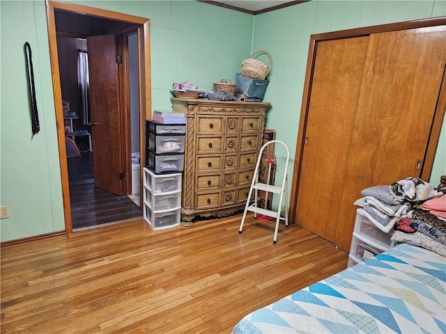 bedroom featuring a closet and light hardwood / wood-style flooring