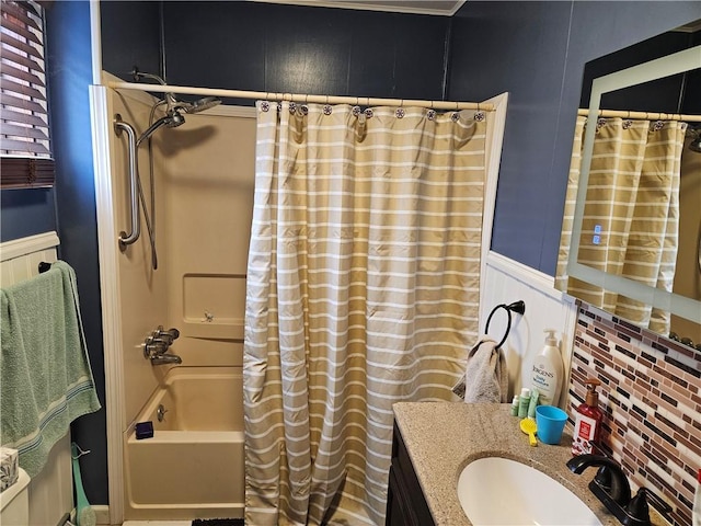 bathroom featuring vanity, shower / tub combo with curtain, and backsplash