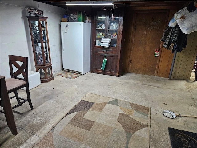 dining space featuring concrete flooring