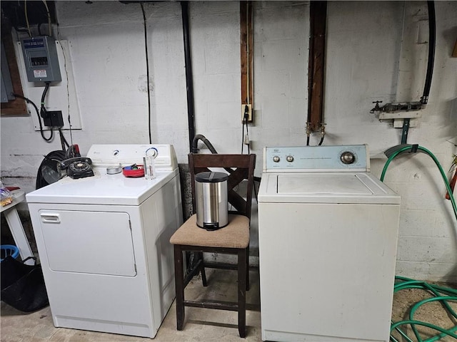 washroom with washing machine and clothes dryer