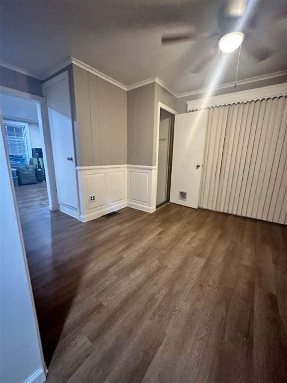 bonus room with dark wood-type flooring and ceiling fan