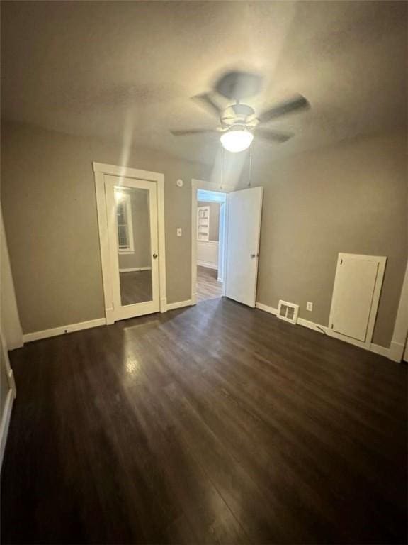 interior space with dark hardwood / wood-style floors and ceiling fan