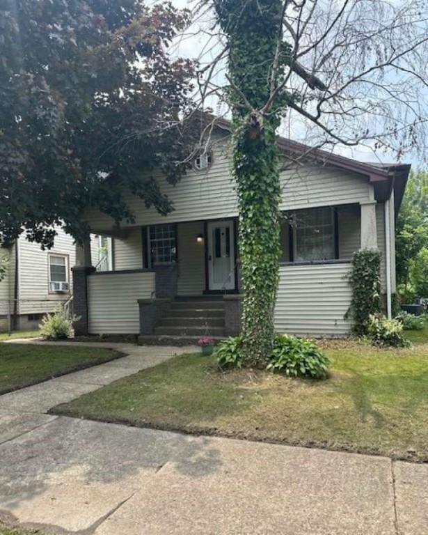 448 Baldwin Ave, Sharon, PA 16146 - obstructed view of property featuring a porch and a front lawn