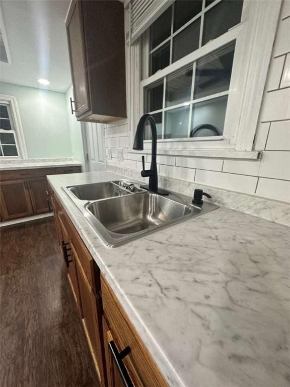 448 Baldwin Ave, Sharon, PA 16146 - kitchen featuring a sink, tasteful backsplash, dark wood finished floors, and light countertops