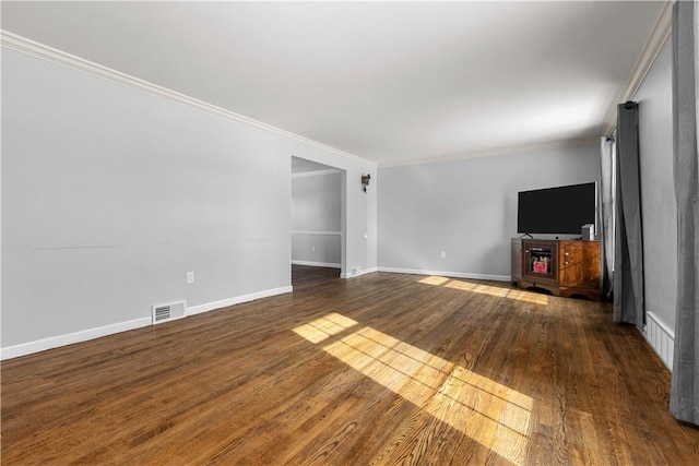 unfurnished living room with ornamental molding and dark hardwood / wood-style floors