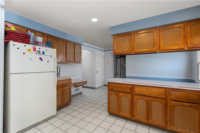 kitchen featuring white fridge