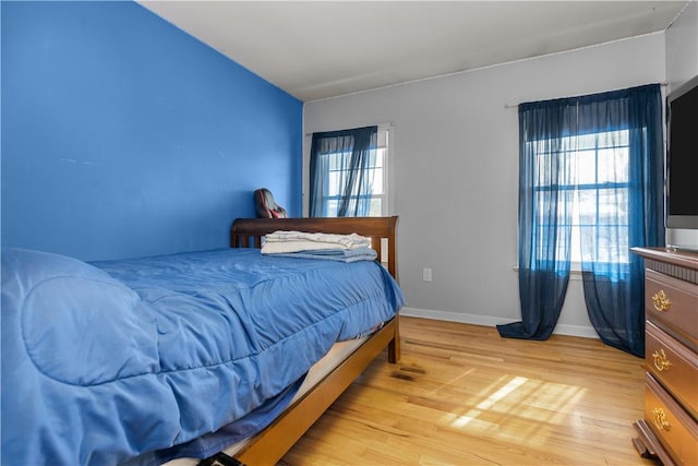 bedroom with light hardwood / wood-style floors