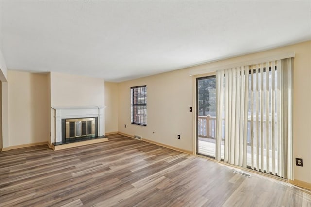 unfurnished living room with hardwood / wood-style floors