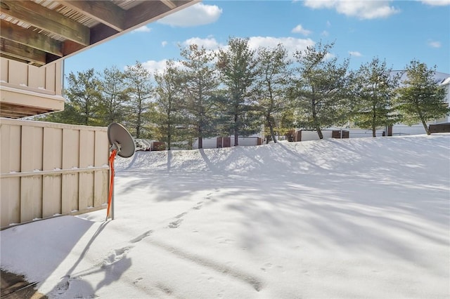 view of yard layered in snow