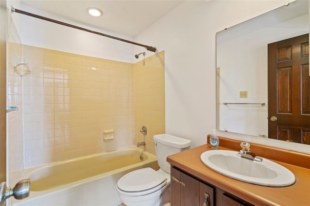 full bathroom with vanity, toilet, and tiled shower / bath combo