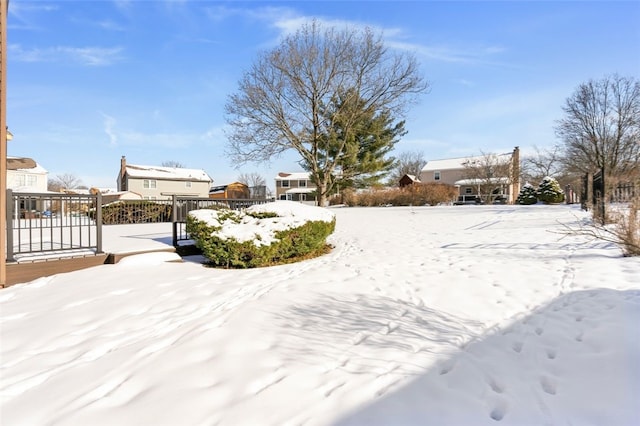 view of yard layered in snow