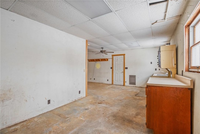 interior space with sink and a drop ceiling