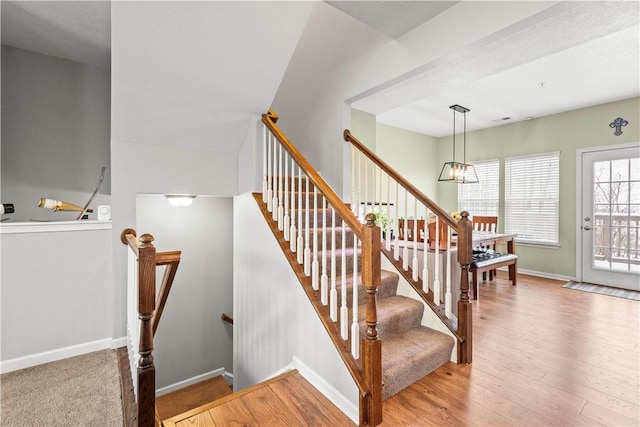 stairway with wood-type flooring