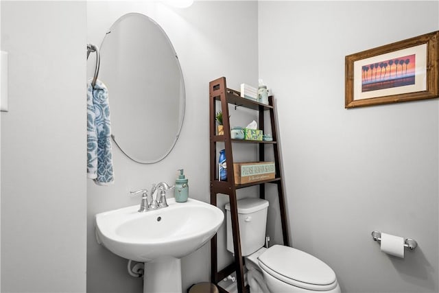 bathroom with sink and toilet