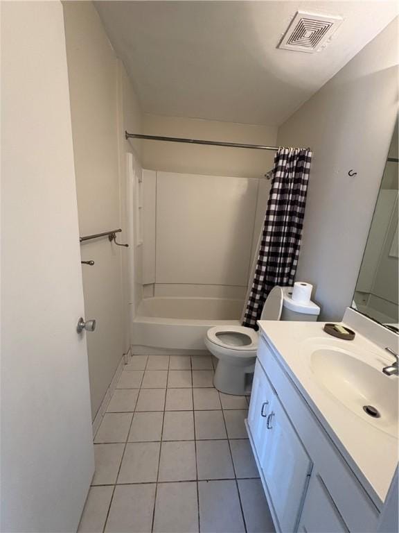 full bathroom with tile patterned flooring, vanity, toilet, and shower / bath combo with shower curtain