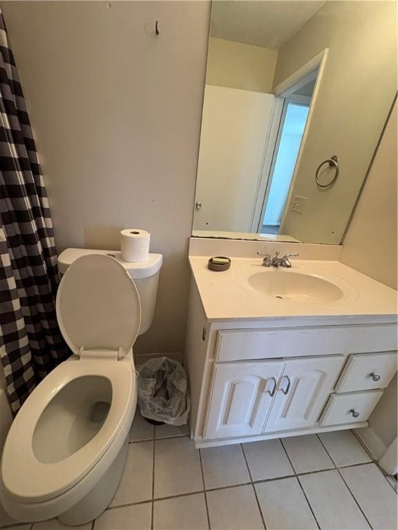 bathroom with a shower with curtain, tile patterned floors, toilet, and vanity