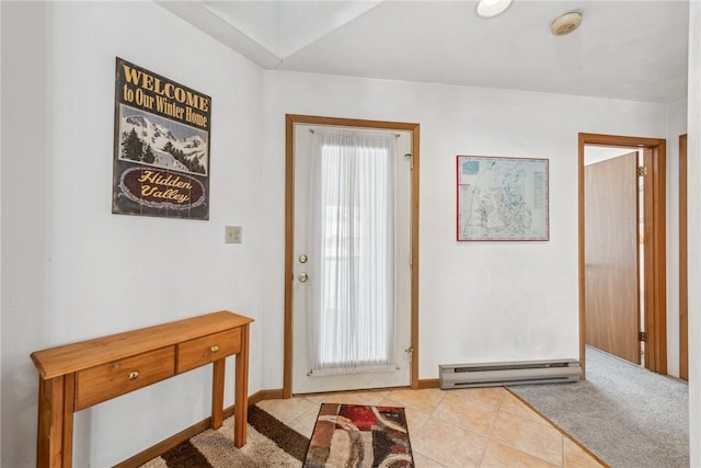 doorway to outside with light tile patterned floors and baseboard heating