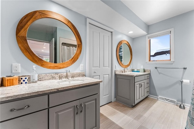 252 Latonka Dr, Jackson Twp Mer, PA 16137 - full bath with two vanities, visible vents, baseboards, and a sink